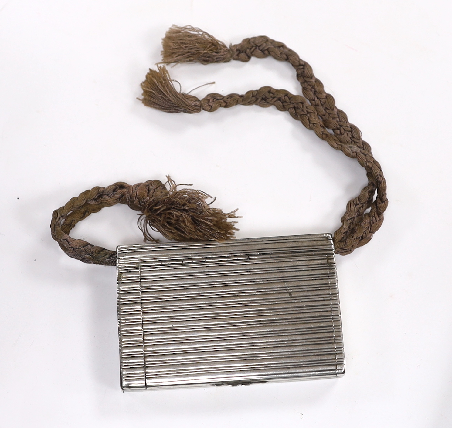 An early 20th century Russian 84 zolotnik cigarette case/vesta, 98mm, gross weight 5.8oz, with suspension cord.